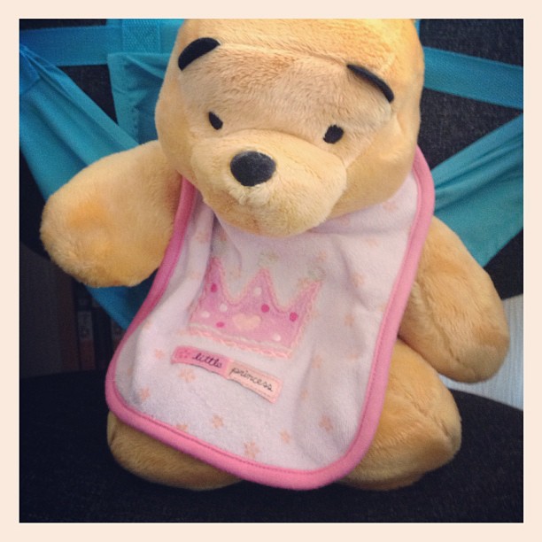Winnie The Pooh is trying out my high chair thing.